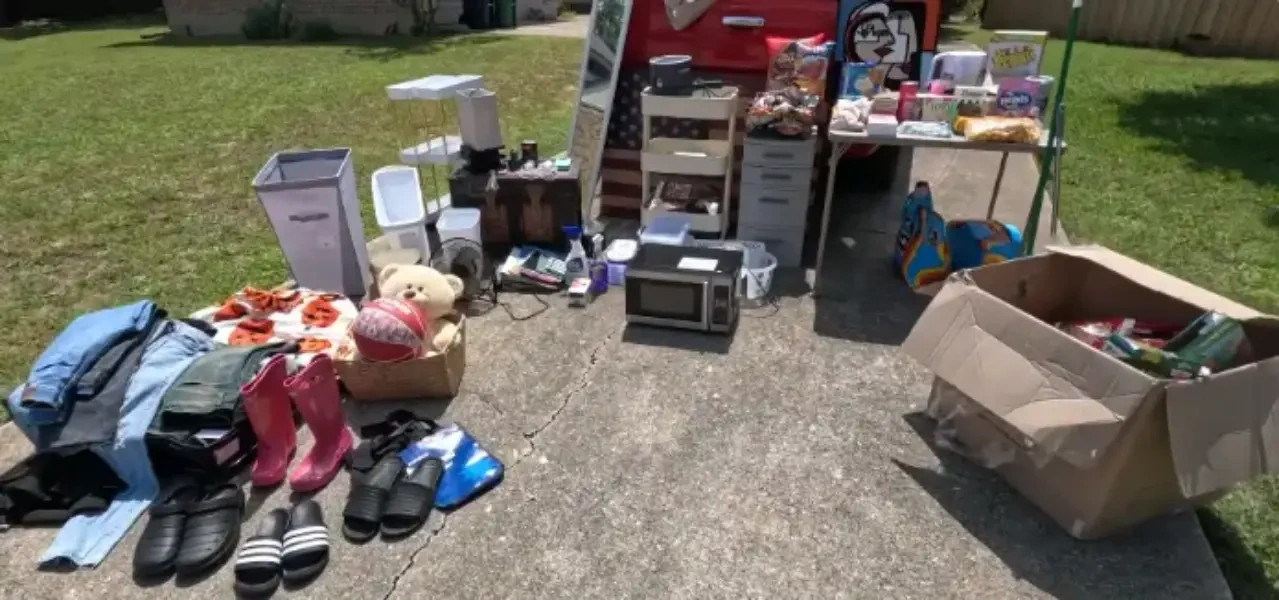 Cleanout dumpster rental Fresno driveway with sorted estate items