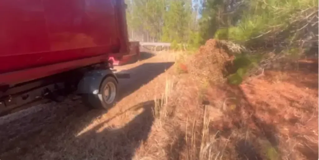 Yard waste debris pile next to a dump trailer in Fresno, CA